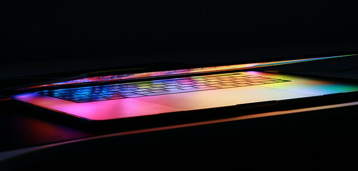 bright shining coloured laptop screen half closed