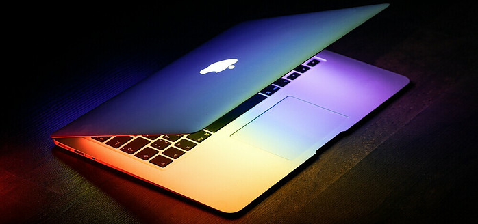 Macbook half opened glowing screen