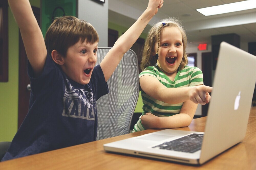 Happy children with laptop