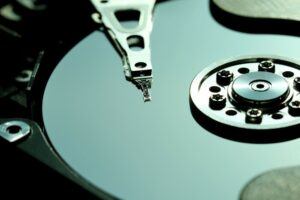 green hdd disk and head