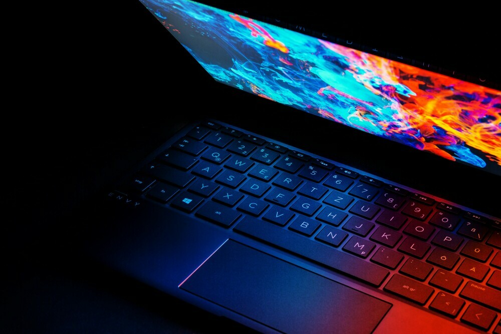 HP Envy with bright colored screen in dark